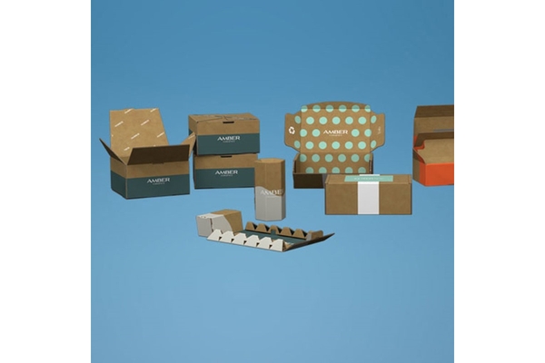 Image Assorted branded cardboard packaging boxes and inserts on blue background